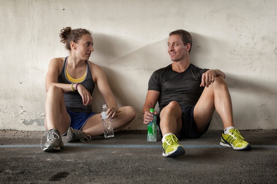Two athletes talking while they recover after exercise.